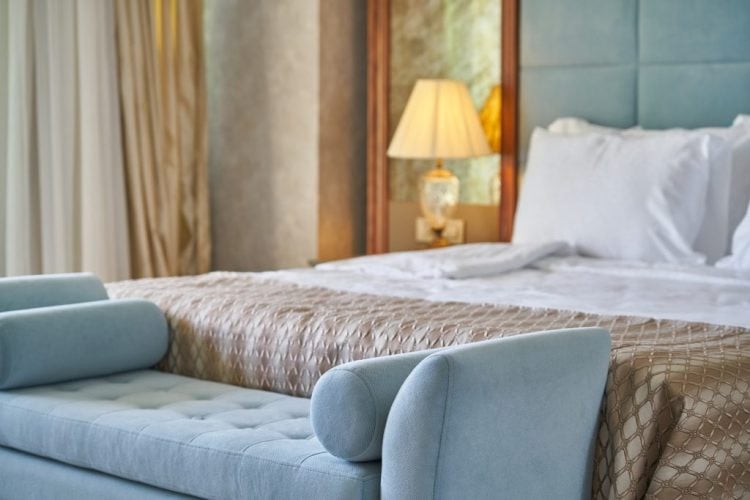 bed and upholstered bench