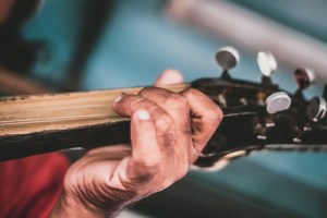 senior playing guitar